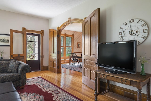 466 Quail Trap Rd, Caledonia, IL 61011 - living area with light wood finished floors and arched walkways