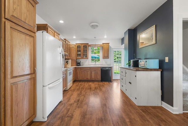 466 Quail Trap Rd, Caledonia, IL 61011 - kitchen featuring white appliances, dark wood-type flooring, glass insert cabinets, brown cabinets, and recessed lighting