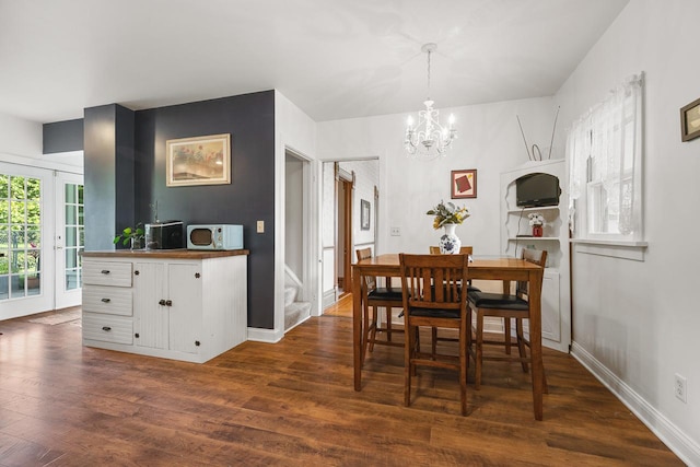 466 Quail Trap Rd, Caledonia, IL 61011 - dining area featuring a chandelier, dark wood-style floors, and stairs