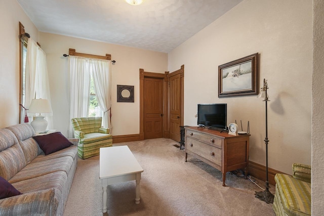 466 Quail Trap Rd, Caledonia, IL 61011 - carpeted living area featuring baseboards and a textured ceiling