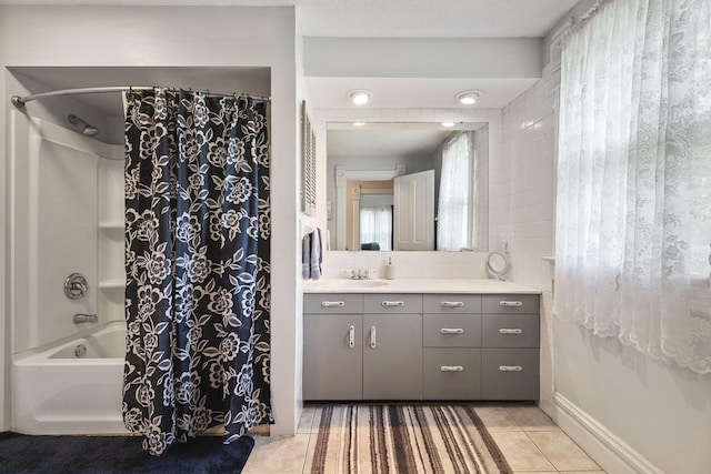 466 Quail Trap Rd, Caledonia, IL 61011 - bathroom featuring vanity, tile patterned flooring, shower / bath combo, and decorative backsplash