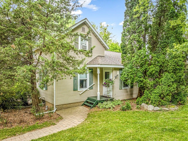 466 Quail Trap Rd, Caledonia, IL 61011 - view of front of property with a shingled roof and a front lawn