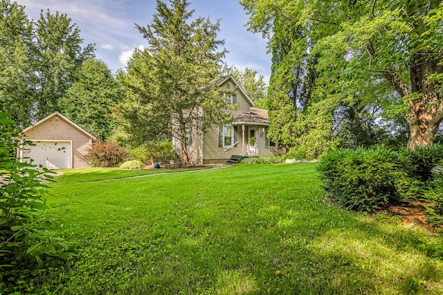 466 Quail Trap Rd, Caledonia, IL 61011 - view of green lawn with a detached garage and an outbuilding