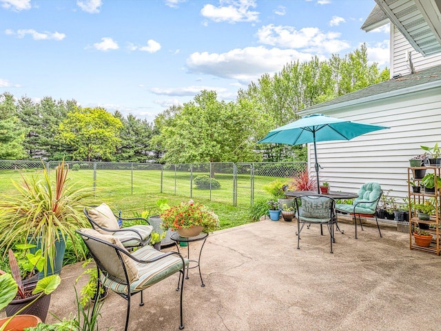 466 Quail Trap Rd, Caledonia, IL 61011 - view of patio featuring outdoor dining area and view of scattered trees