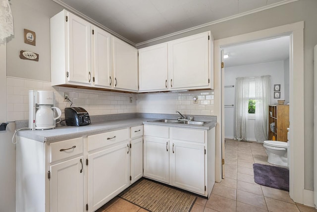 466 Quail Trap Rd, Caledonia, IL 61011 - kitchen featuring backsplash, white cabinets, and light countertops