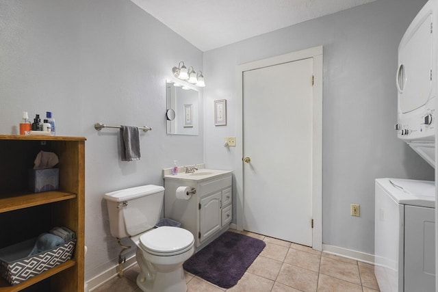 466 Quail Trap Rd, Caledonia, IL 61011 - bathroom with stacked washer / dryer, vanity, and tile patterned flooring