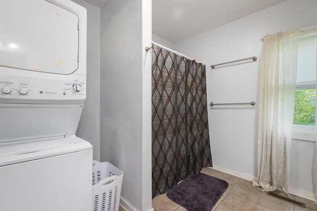 466 Quail Trap Rd, Caledonia, IL 61011 - washroom featuring stacked washing machine and dryer and tile patterned floors
