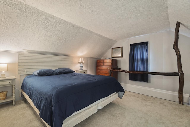 466 Quail Trap Rd, Caledonia, IL 61011 - bedroom featuring a textured ceiling, carpet flooring, and lofted ceiling