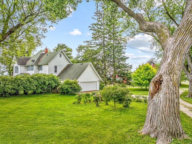 466 Quail Trap Rd, Caledonia, IL 61011 - view of grassy yard featuring a garage