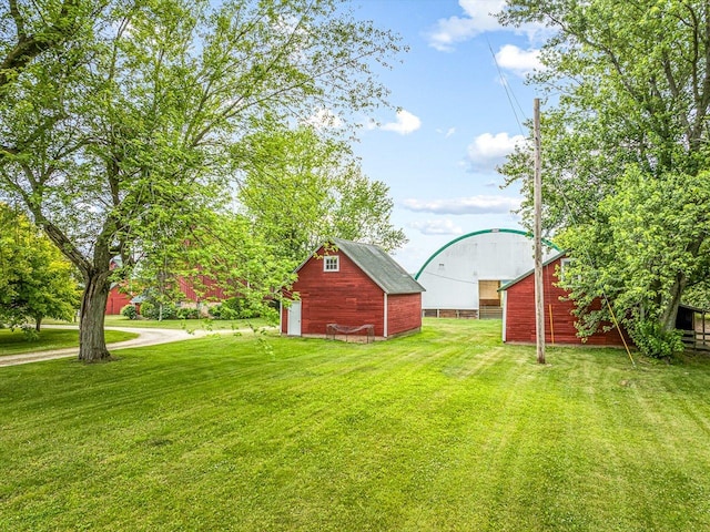 466 Quail Trap Rd, Caledonia, IL 61011 - view of green lawn with an outdoor structure and a barn