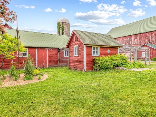 466 Quail Trap Rd, Caledonia, IL 61011 - back of property featuring a yard and an outbuilding