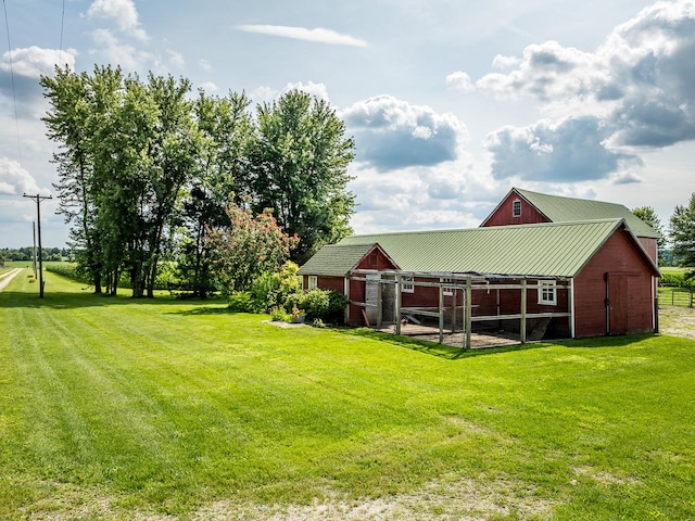 466 Quail Trap Rd, Caledonia, IL 61011 - view of green lawn featuring an outbuilding