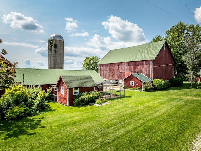 466 Quail Trap Rd, Caledonia, IL 61011 - view of green lawn featuring an outdoor structure and a barn
