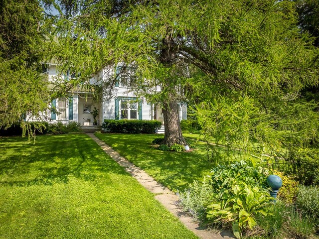 466 Quail Trap Rd, Caledonia, IL 61011 - view of front of home with a front yard