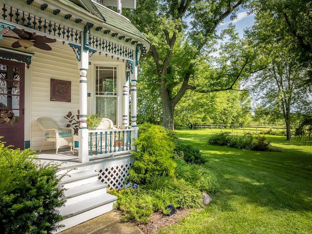 466 Quail Trap Rd, Caledonia, IL 61011 - view of exterior entry featuring ceiling fan and a porch