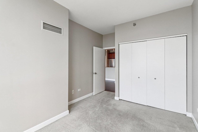 1841 S Calumet Ave Unit 1302, Chicago, IL 60616 - unfurnished bedroom with light carpet, stainless steel fridge, and a closet