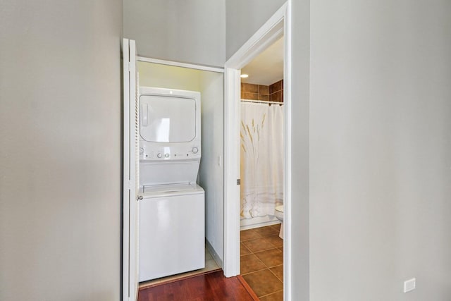 1841 S Calumet Ave Unit 1302, Chicago, IL 60616 - laundry area featuring stacked washer and clothes dryer and dark tile patterned flooring