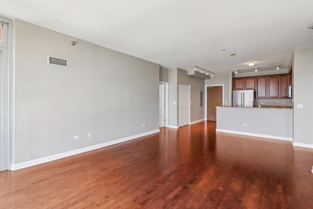 1841 S Calumet Ave Unit 1302, Chicago, IL 60616 - unfurnished living room featuring wood finished floors and rail lighting