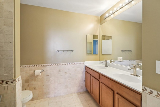 1841 S Calumet Ave Unit 1302, Chicago, IL 60616 - bathroom with tile walls, double vanity, and wainscoting