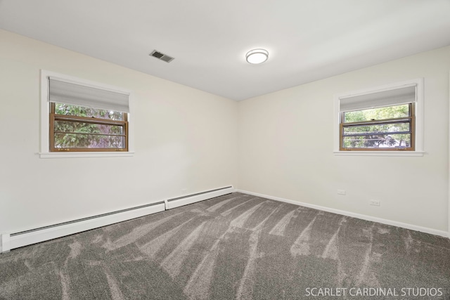 140 W Adams St, Villa Park, IL 60181 - empty room with a baseboard heating unit, healthy amount of natural light, and carpet floors
