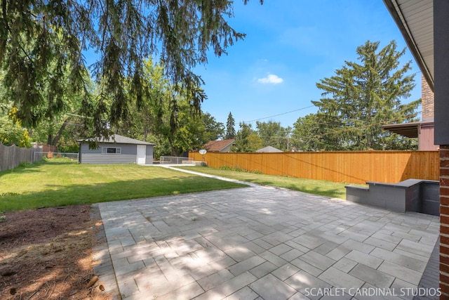 140 W Adams St, Villa Park, IL 60181 - fenced backyard with an outbuilding and a patio area