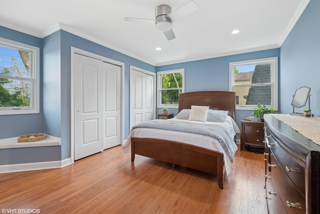 1407 N Dunton Ave, Arlington Heights, IL 60004 - bedroom featuring two closets, light wood-style floors, crown molding, a ceiling fan, and recessed lighting