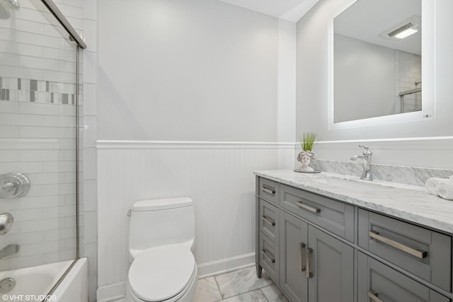 1407 N Dunton Ave, Arlington Heights, IL 60004 - bathroom with vanity, a wainscoted wall, bathtub / shower combination, and marble finish flooring