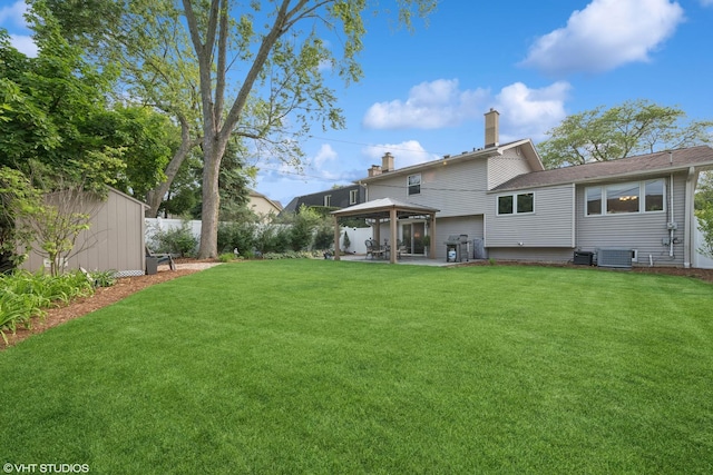 1407 N Dunton Ave, Arlington Heights, IL 60004 - rear view of property with a gazebo, a chimney, a storage unit, and a patio area