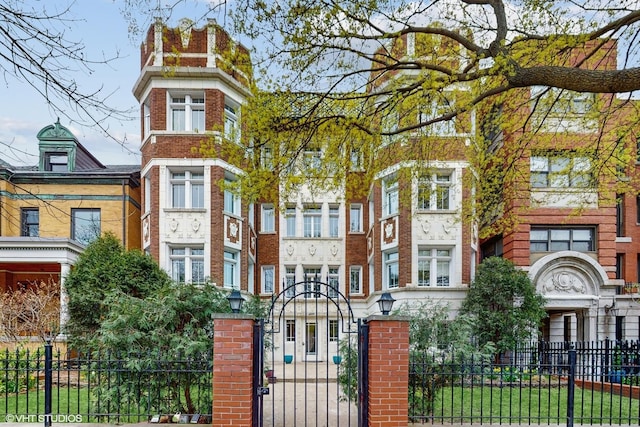 4550 N Malden St Unit 1W, Chicago, IL 60640 - view of front of home with a fenced front yard and brick siding