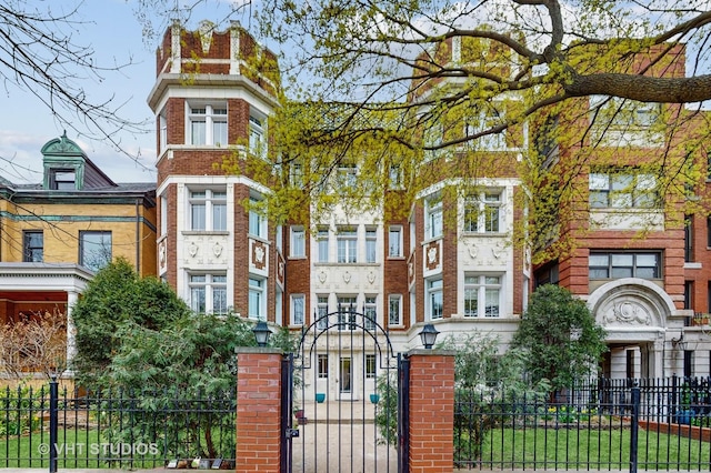 4550 N Malden St Unit 1W, Chicago, IL 60640 - view of front facade with a fenced front yard and brick siding