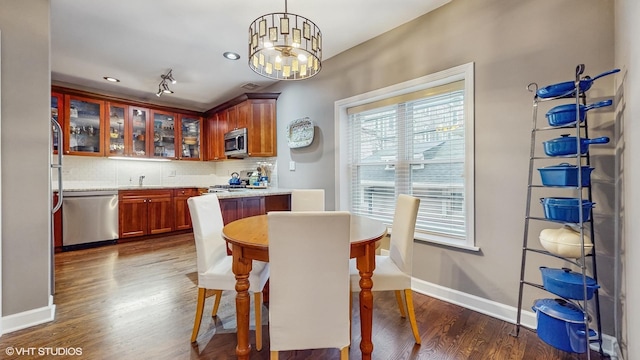 4550 N Malden St Unit 1W, Chicago, IL 60640 - dining room featuring dark wood-style flooring and a chandelier