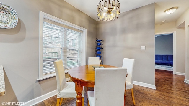 4550 N Malden St Unit 1W, Chicago, IL 60640 - dining room featuring wood finished floors and a chandelier