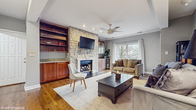 4550 N Malden St Unit 1W, Chicago, IL 60640 - living room with ceiling fan, a fireplace, dark wood-style floors, recessed lighting, and crown molding