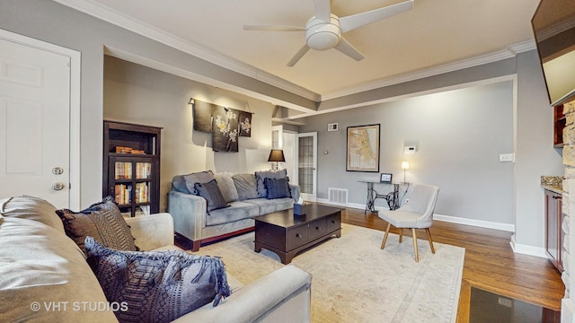 4550 N Malden St Unit 1W, Chicago, IL 60640 - living area featuring wood finished floors, a ceiling fan, crown molding, and a fireplace