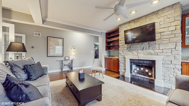 4550 N Malden St Unit 1W, Chicago, IL 60640 - living room featuring ceiling fan, wood finished floors, built in features, a fireplace, and ornamental molding