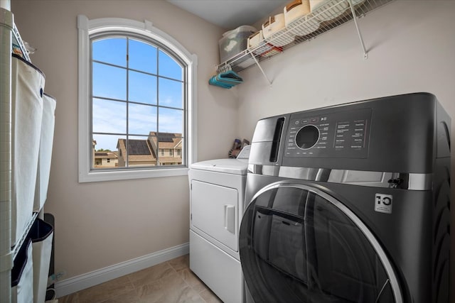 2321 Corrigan Way, Normal, IL 61761 - washroom with washing machine and dryer and light tile patterned flooring