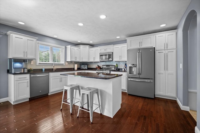 2321 Corrigan Way, Normal, IL 61761 - kitchen featuring stainless steel appliances, dark countertops, white cabinets, backsplash, and recessed lighting