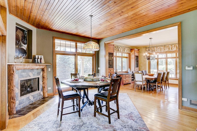 42720 N Converse Rd, Antioch, IL 60002 - dining room featuring a chandelier, wooden ceiling, a fireplace, and light wood finished floors