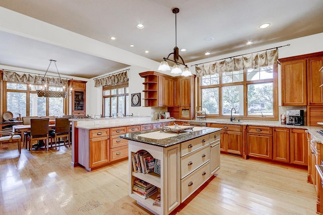42720 N Converse Rd, Antioch, IL 60002 - kitchen featuring open shelves, a chandelier, light wood-style flooring, light stone counters, and recessed lighting