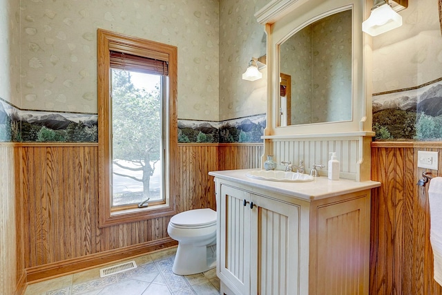 42720 N Converse Rd, Antioch, IL 60002 - half bath featuring wallpapered walls, wainscoting, vanity, and tile patterned flooring