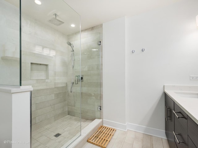 2707 W Belmont Ave Unit 4W, Chicago, IL 60618 - full bath featuring vanity, a shower stall, and recessed lighting