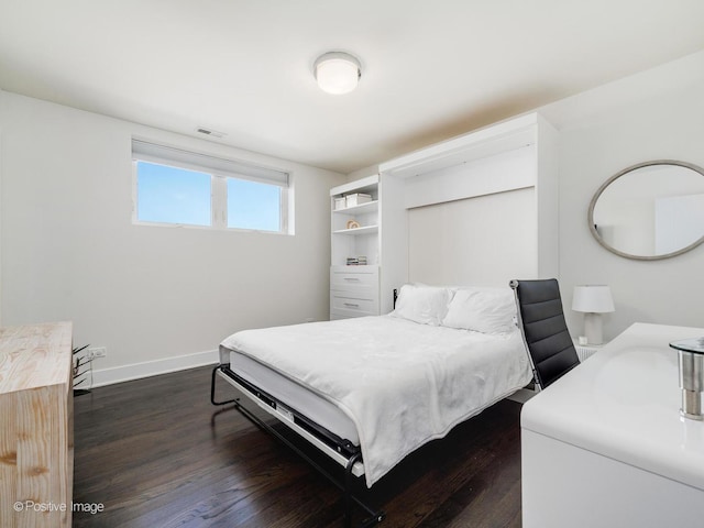 2707 W Belmont Ave Unit 4W, Chicago, IL 60618 - bedroom with dark wood-style flooring and baseboards