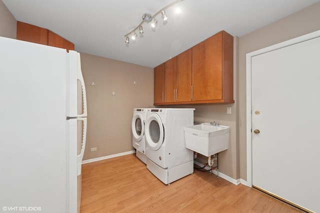 2741 Acacia Ter, Buffalo Grove, IL 60089 - washroom with washing machine and clothes dryer, light wood-style flooring, and cabinet space