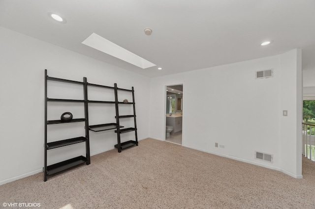 2741 Acacia Ter, Buffalo Grove, IL 60089 - spare room featuring a skylight, carpet floors, and recessed lighting