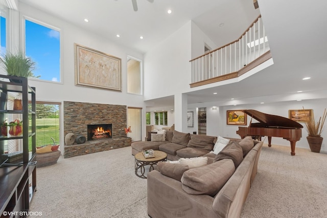2741 Acacia Ter, Buffalo Grove, IL 60089 - carpeted living room with a high ceiling, a fireplace, and recessed lighting