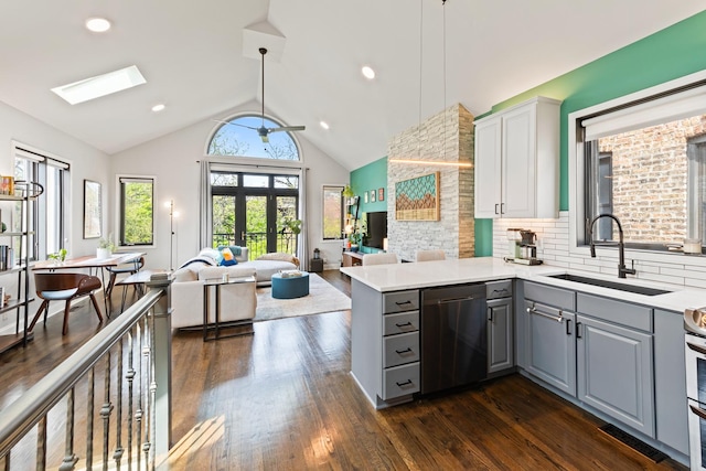 3047 N Racine Ave Unit 3, Chicago, IL 60657 - kitchen with dishwasher, gray cabinets, open floor plan, a skylight, and lofted ceiling