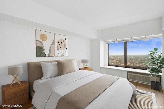 175 E Delaware Pl Unit 6021, Chicago, IL 60611 - bedroom featuring a wall mounted air conditioner and wood finished floors