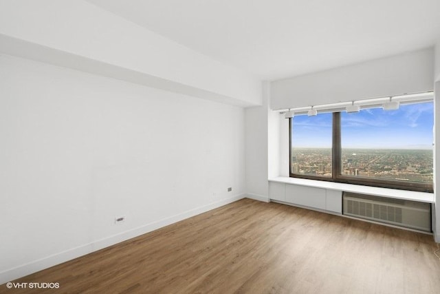 175 E Delaware Pl Unit 6021, Chicago, IL 60611 - spare room featuring wood finished floors and baseboards