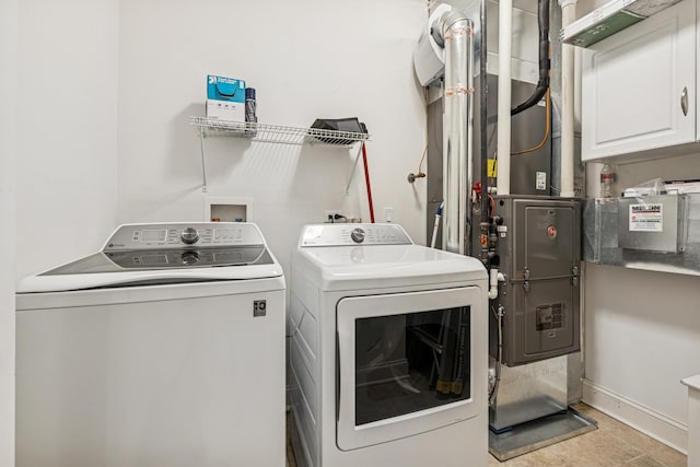 4660 N Winthrop Ave Unit 1N, Chicago, IL 60640 - washroom with washer and dryer and cabinet space