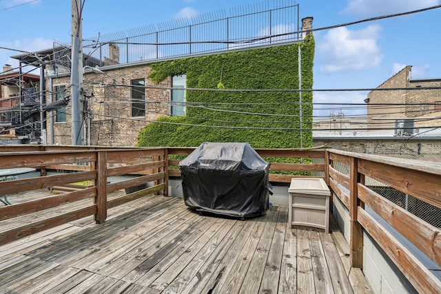 4660 N Winthrop Ave Unit 1N, Chicago, IL 60640 - wooden terrace featuring a grill
